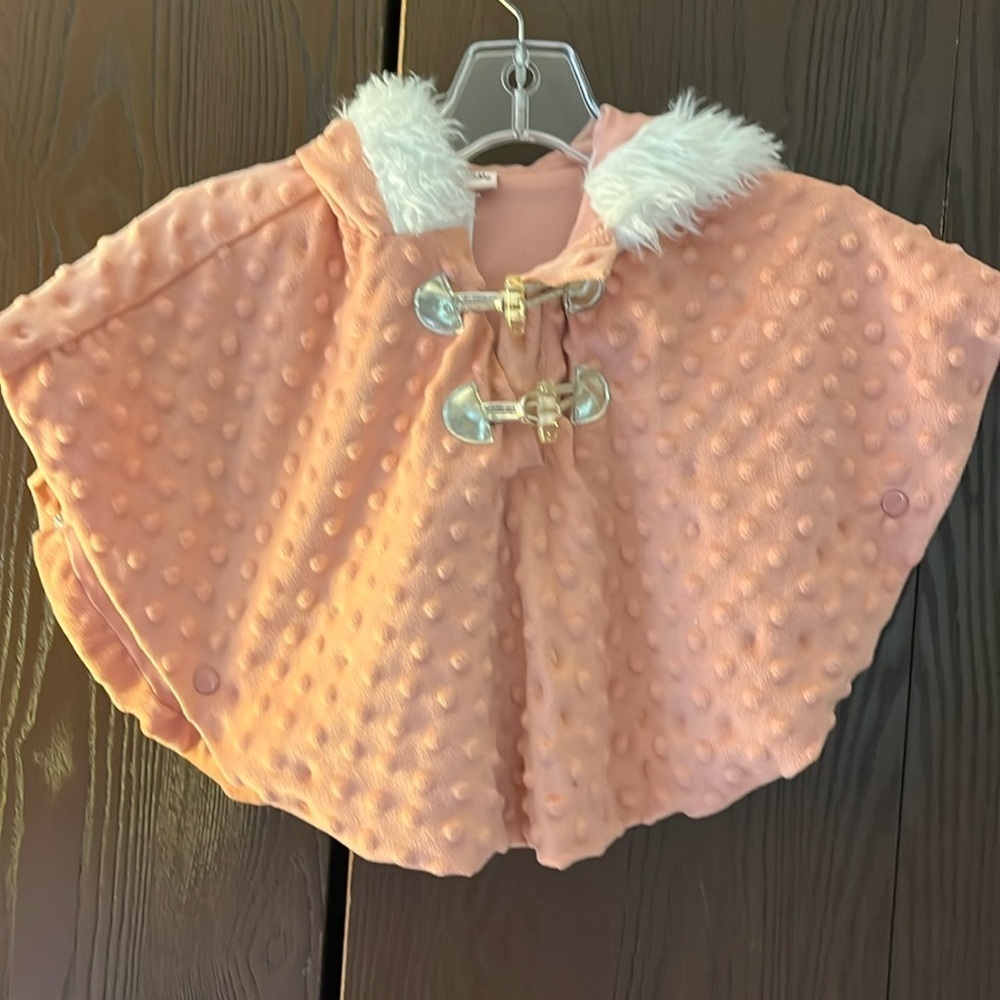 Little Lass child's rosy colored, hooded cape with arm openings. Size 2T